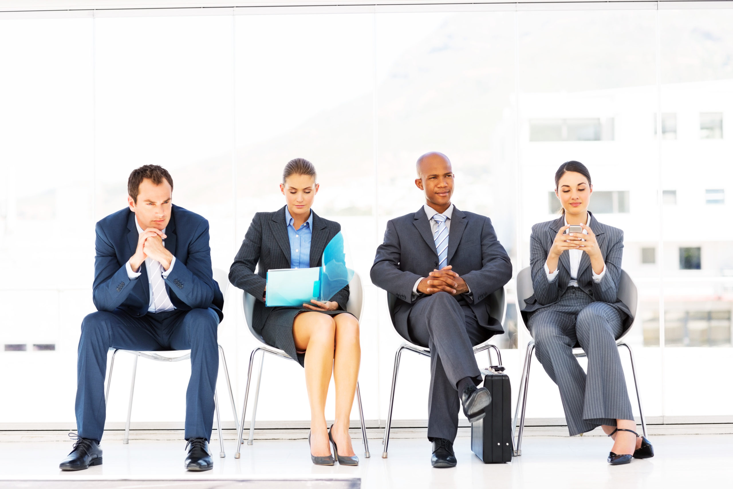 Diverse group of professionals waiting for career interviews
